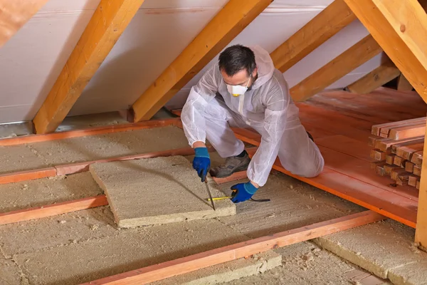 depositphotos_60188103-stock-photo-man-laying-thermal-insulation-layer